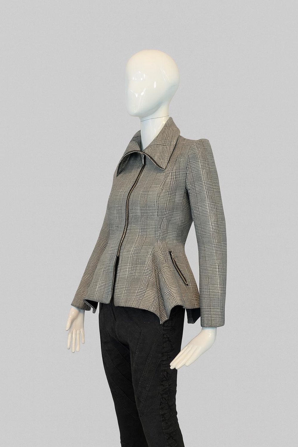 Obsidian Peplum Jacket — black and white futuristic peplum jacket on a mannequin